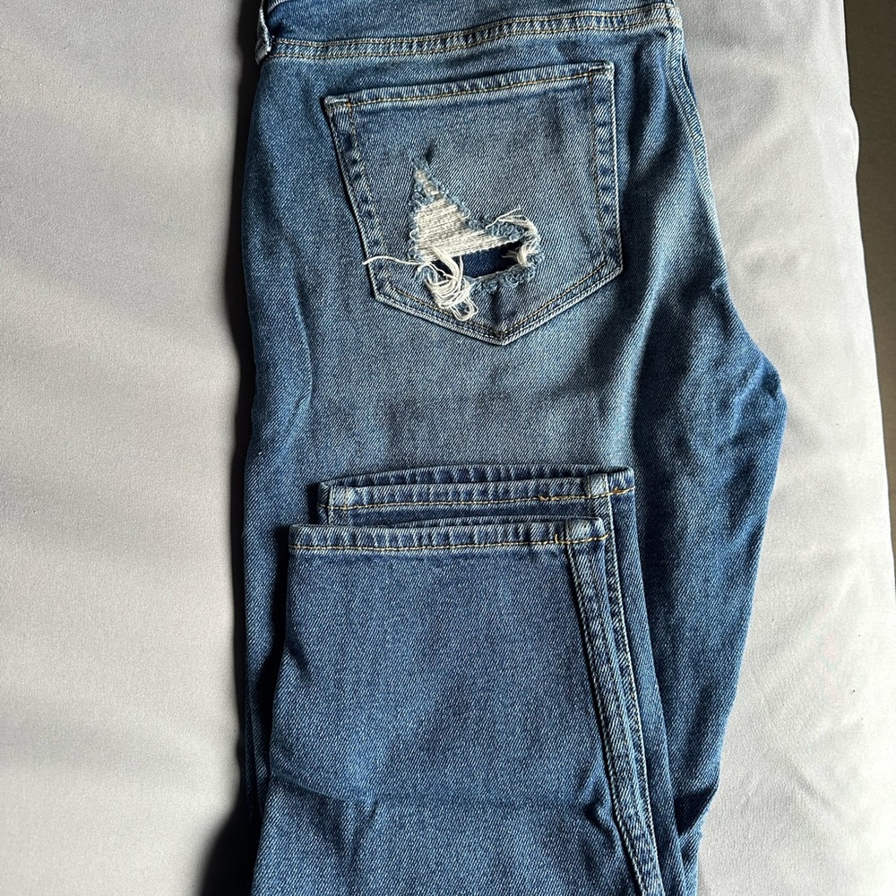 Distressed Blue Denim Jeans